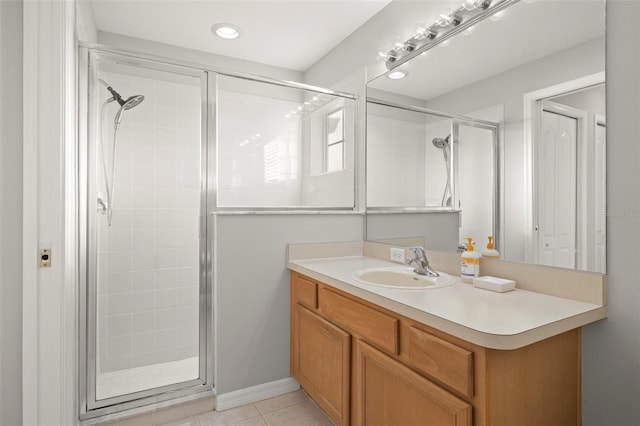 bathroom with tile patterned flooring, vanity, and an enclosed shower