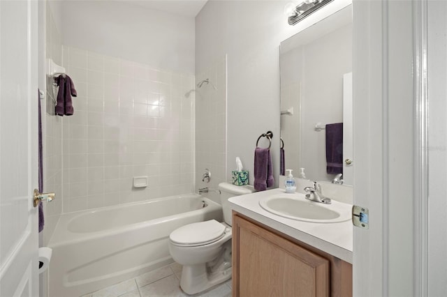 full bathroom featuring tile patterned floors, vanity, toilet, and tiled shower / bath