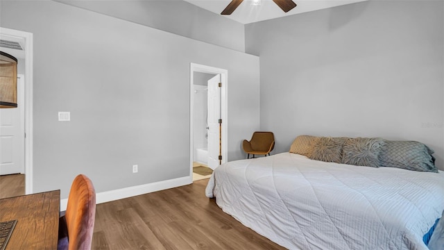 bedroom with ceiling fan, wood-type flooring, and ensuite bath