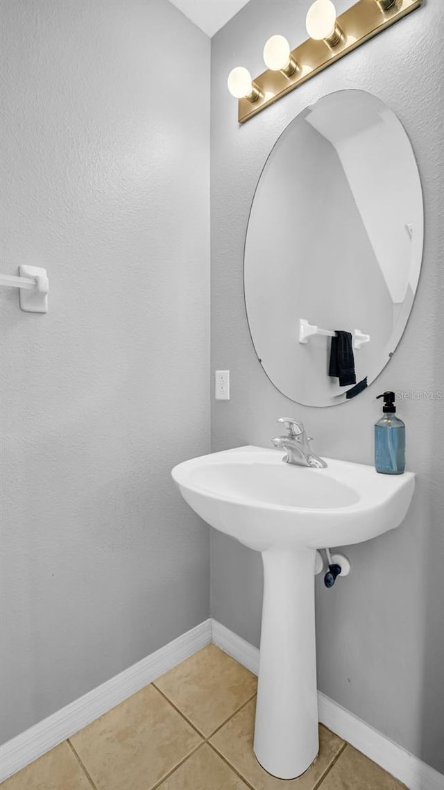 bathroom featuring tile patterned floors and sink