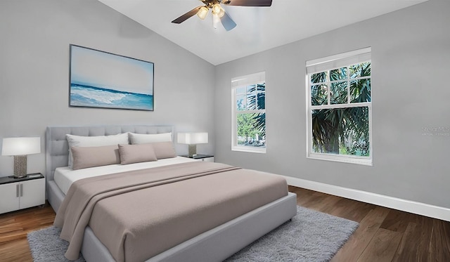 bedroom featuring ceiling fan, wood-type flooring, and vaulted ceiling