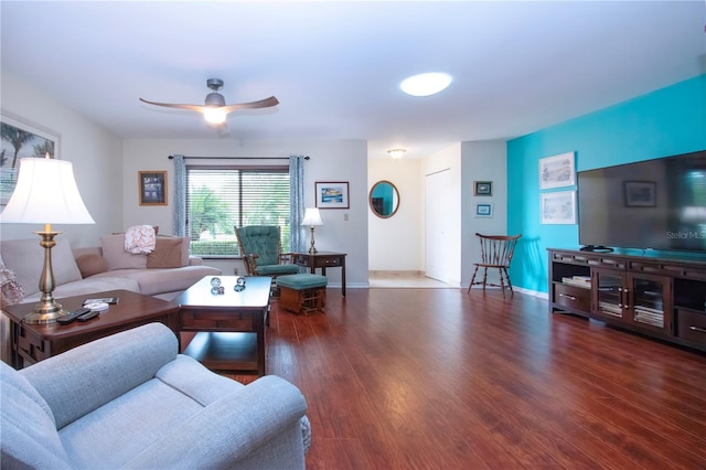 living room with dark hardwood / wood-style floors and ceiling fan