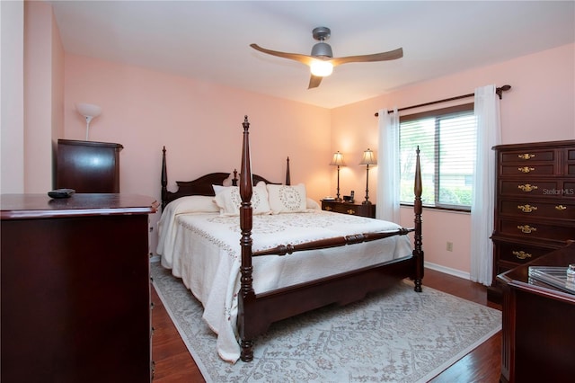 bedroom featuring ceiling fan and dark hardwood / wood-style floors