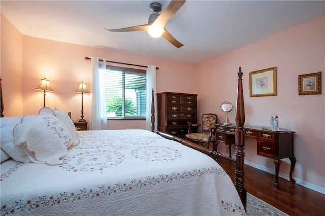 bedroom with ceiling fan and dark hardwood / wood-style flooring