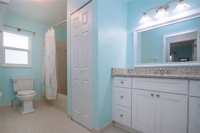 full bathroom featuring tile patterned floors, vanity, toilet, and shower / bath combo with shower curtain