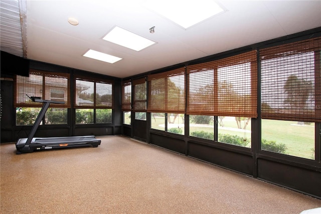 unfurnished sunroom with lofted ceiling