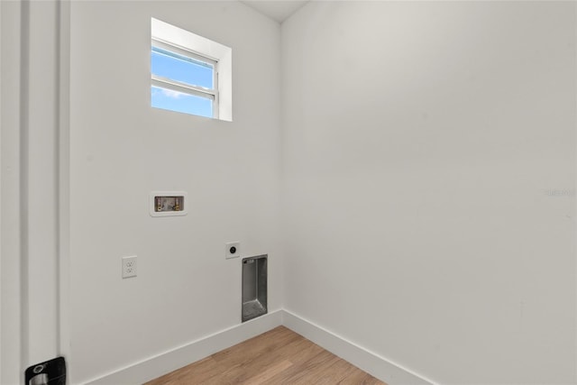 washroom featuring electric dryer hookup, hookup for a washing machine, and hardwood / wood-style floors