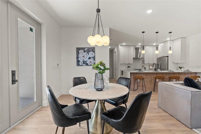 dining space featuring light wood-type flooring