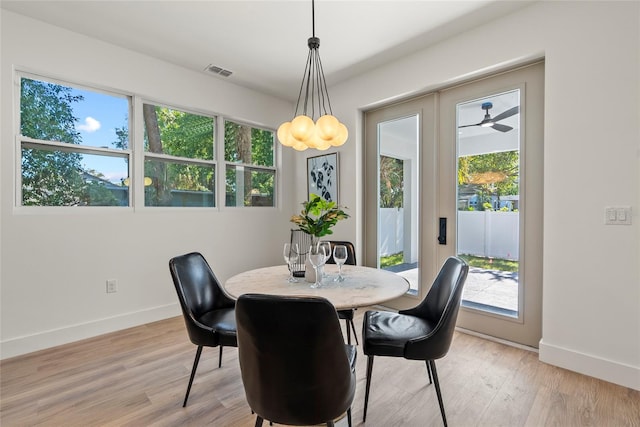 dining room featuring ceiling fan and light hardwood / wood-style flooring