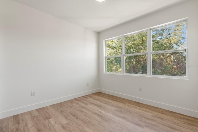 unfurnished room featuring light wood-type flooring