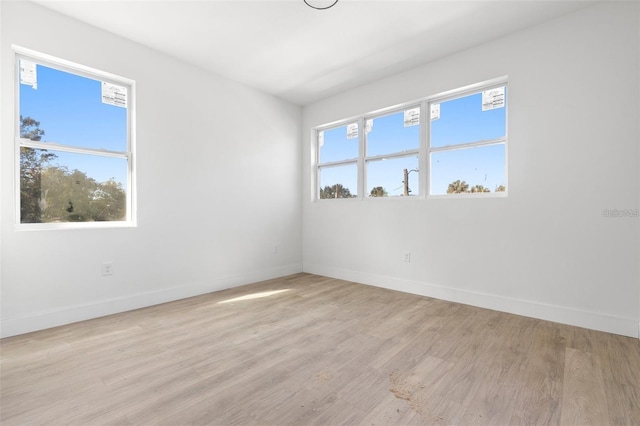 unfurnished room featuring light wood-type flooring