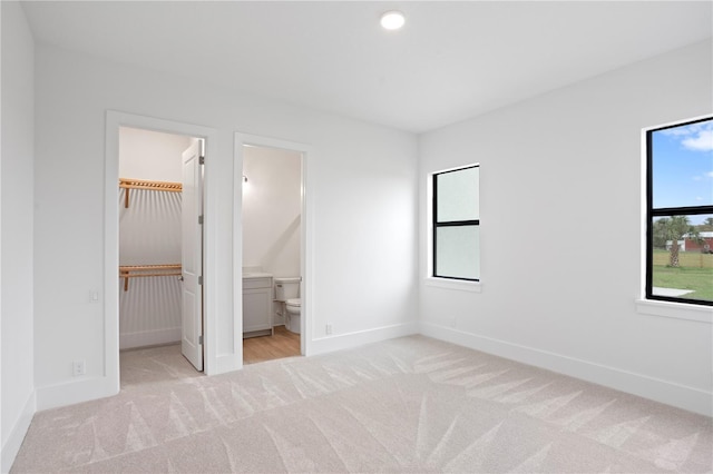 unfurnished bedroom with carpet and baseboards