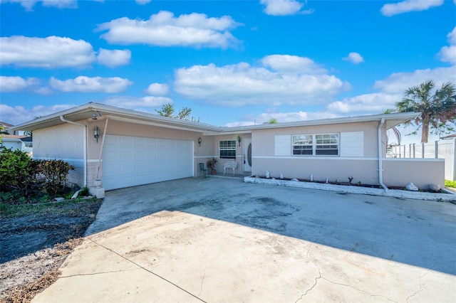 single story home with a garage