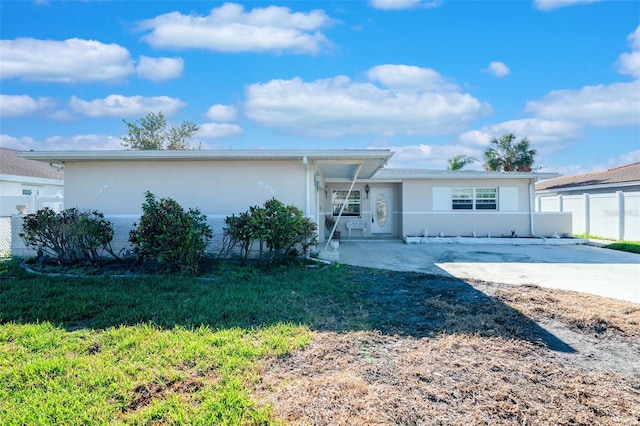 single story home with a front yard