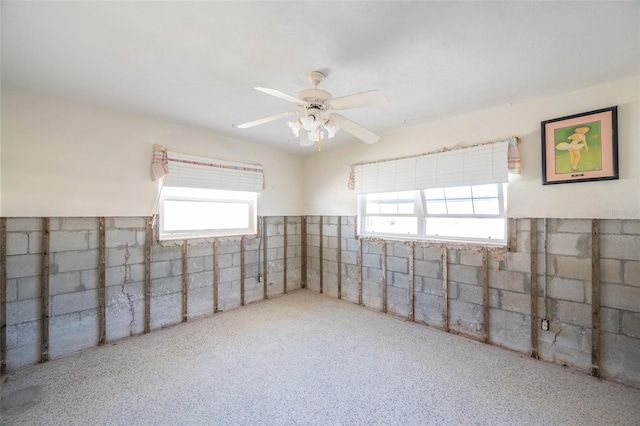 unfurnished room with ceiling fan