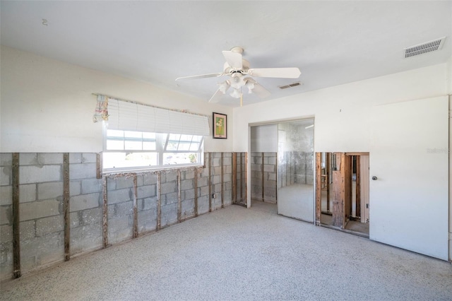 unfurnished room with ceiling fan