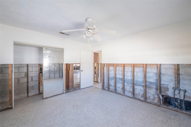 unfurnished room with ceiling fan