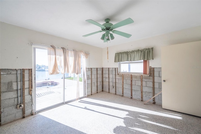 unfurnished room featuring ceiling fan