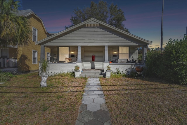 bungalow-style home featuring a yard