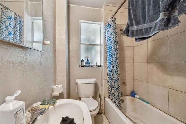 full bathroom with toilet, shower / bathtub combination with curtain, and sink