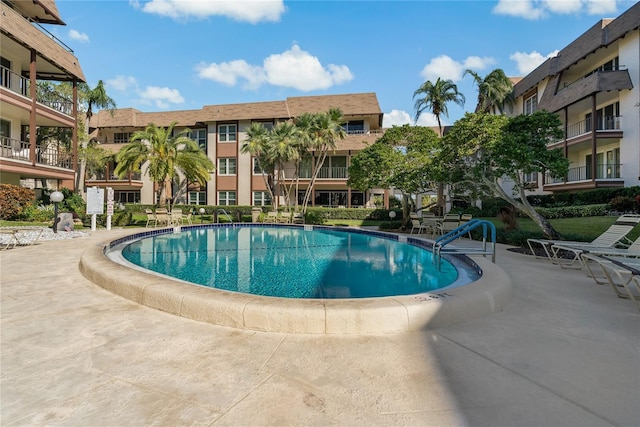 view of swimming pool featuring a patio area