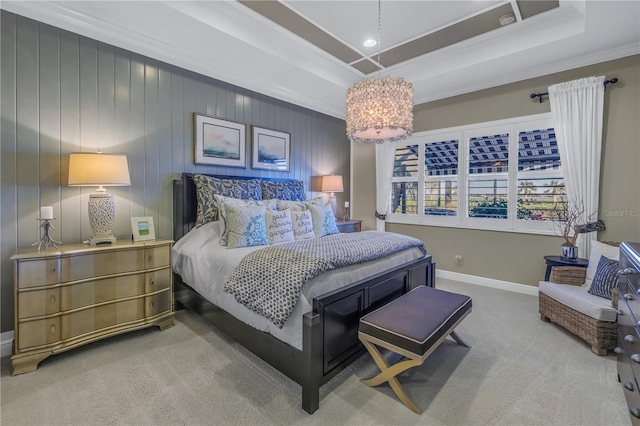 carpeted bedroom featuring wooden walls, a raised ceiling, crown molding, and a notable chandelier