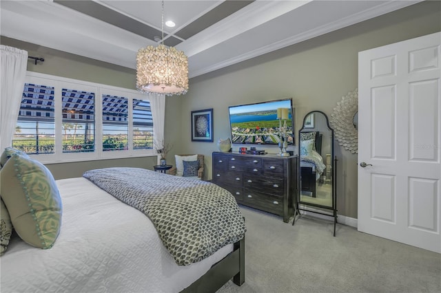 carpeted bedroom featuring a chandelier, a raised ceiling, and crown molding