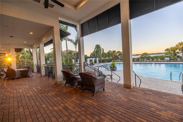 exterior space with ceiling fan and a community pool