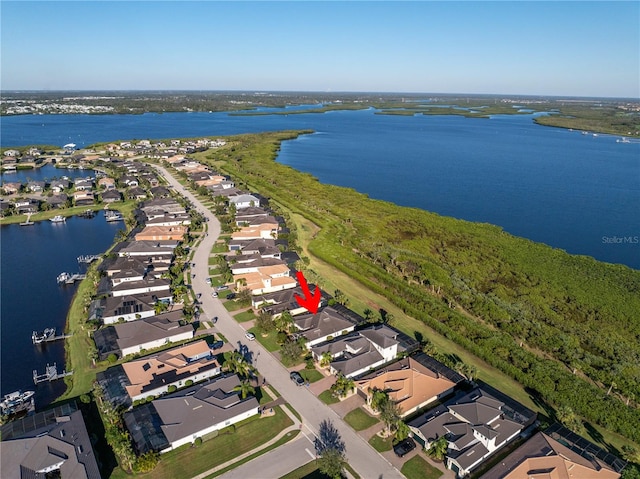 birds eye view of property featuring a water view