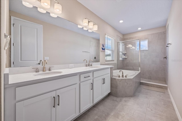 bathroom featuring tile patterned floors, vanity, and plus walk in shower