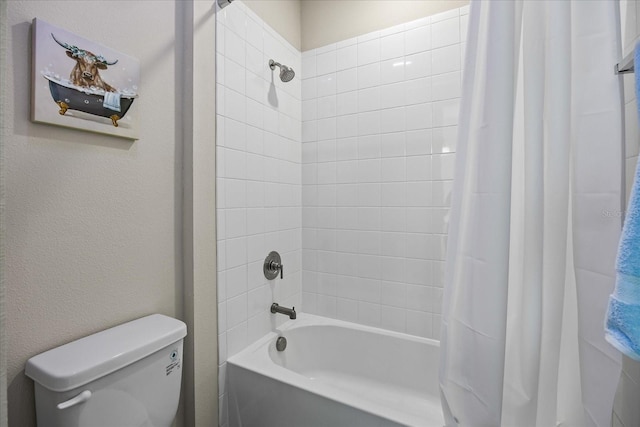 bathroom with toilet and shower / tub combo