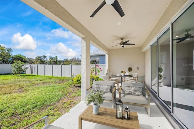 view of patio featuring an outdoor hangout area and ceiling fan