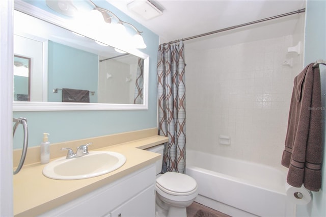 full bathroom featuring vanity, shower / bathtub combination with curtain, and toilet