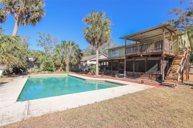 view of swimming pool with a wooden deck