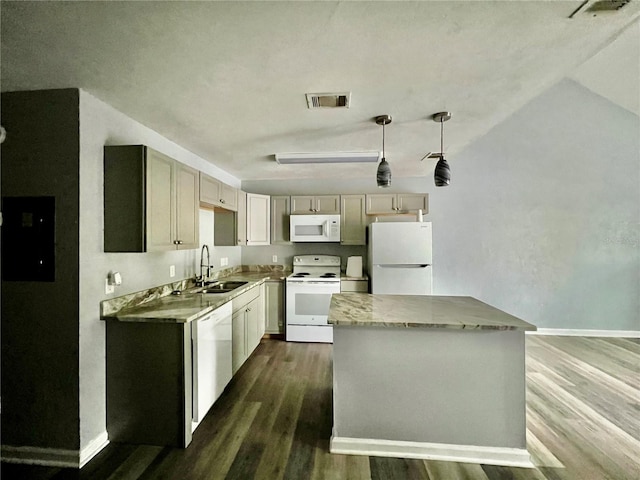 kitchen featuring pendant lighting, white appliances, lofted ceiling, sink, and dark hardwood / wood-style floors