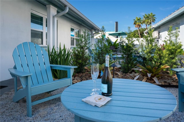 12321 Gulf Blvd, Treasure Island, FL 33706 - surrounding community with outdoor dining space and a patio