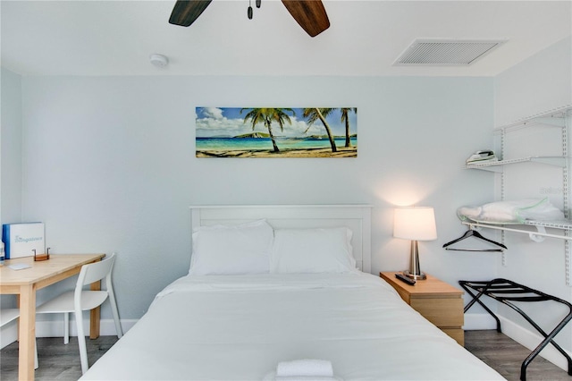 12321 Gulf Blvd, Treasure Island, FL 33706 - bedroom with wood finished floors, baseboards, and a ceiling fan