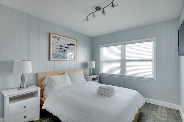 12321 Gulf Blvd, Treasure Island, FL 33706 - bedroom featuring wood finished floors, baseboards, and wood walls
