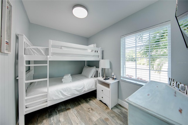 12321 Gulf Blvd, Treasure Island, FL 33706 - bedroom featuring wood finished floors and multiple windows