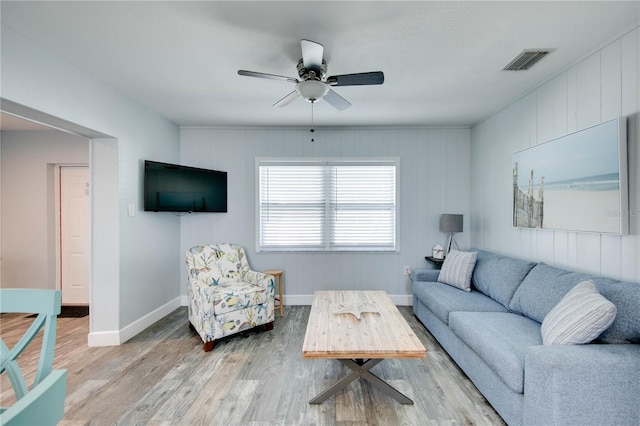 12321 Gulf Blvd, Treasure Island, FL 33706 - living room with wood finished floors, baseboards, and a ceiling fan