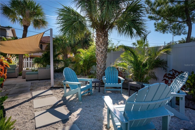 12321 Gulf Blvd, Treasure Island, FL 33706 - fenced backyard with a patio area