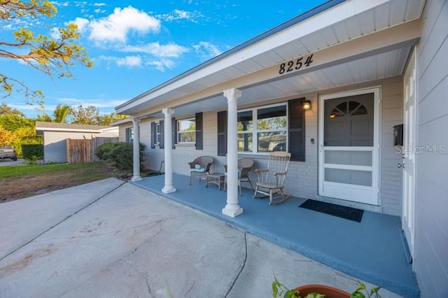 entrance to property featuring a porch