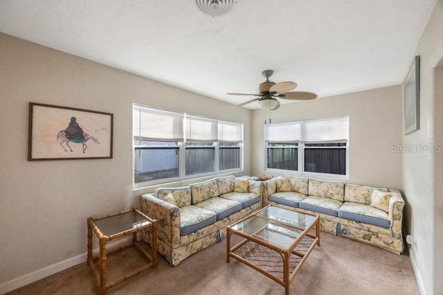 carpeted living room featuring ceiling fan