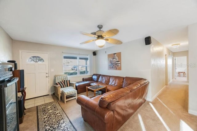 living room featuring light colored carpet and ceiling fan