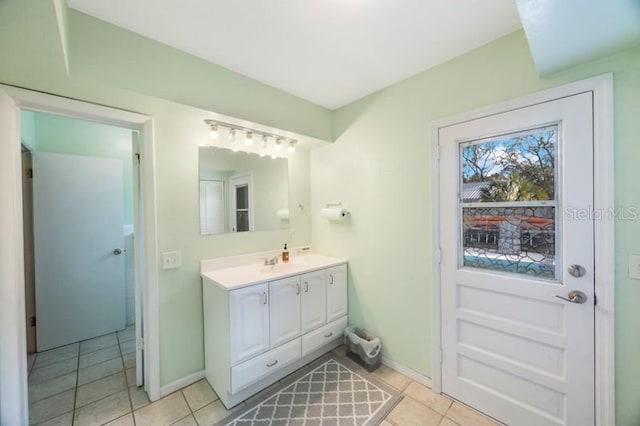 bathroom with tile patterned flooring and vanity