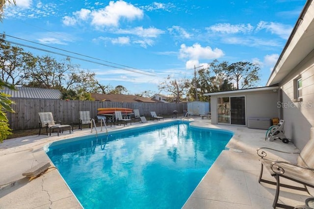 view of swimming pool with a patio