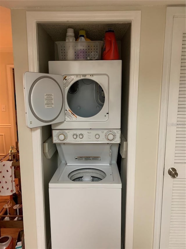 laundry room featuring stacked washing maching and dryer