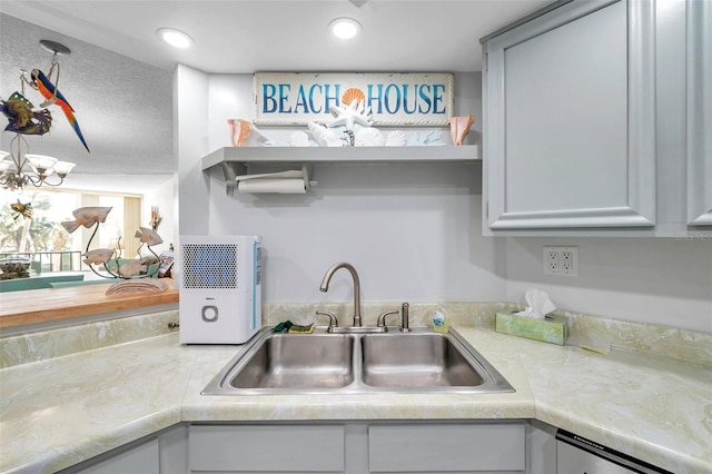 kitchen with a notable chandelier and sink