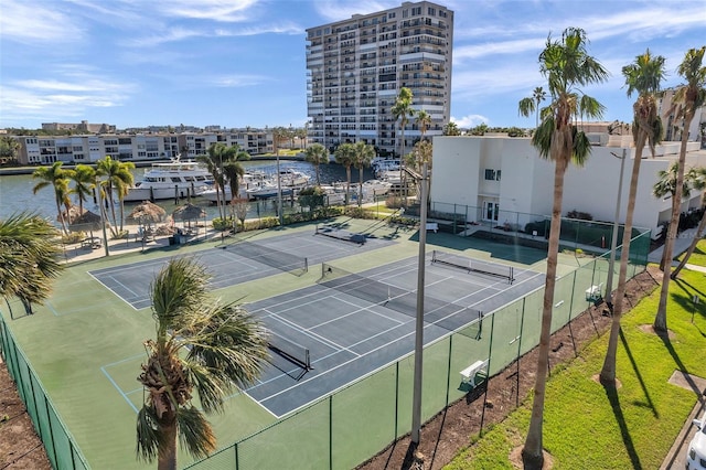 view of sport court featuring a water view