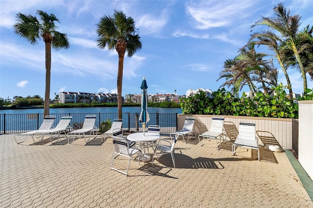 view of patio with a water view